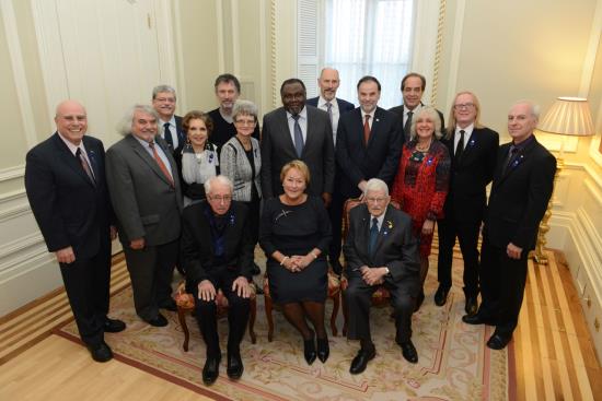Author :Rémy Boily, Studio de Photographie et Banque d’images. Date : 12/11/1913 From left to right and from the back: Phil Gold, Daniel Bertolino, Michel L.Tremblay, Monique Leyrac, Robert Morin, Madeleine Juneau, Maka Kotto, ministre de la Culture et des Communications, James D. Wuest, Pierre Duchesne, ministre de l'Enseignement supérieur, de la Recherche, de la Science et de la Technologie, Marcel Fournier, Marguerite Mendell, Roger Des Roches, Roger Lecomte, Marcel Barbeau, Pauline Marois, première ministre du Québec, Paul Gérin-Lajoie.